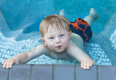 Toddler Swimming in Pool