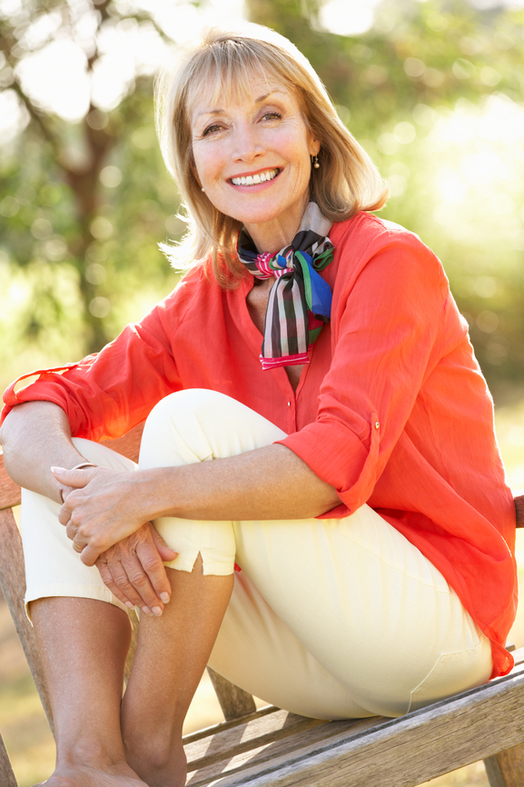 Happy Senior Woman Sitting Outside