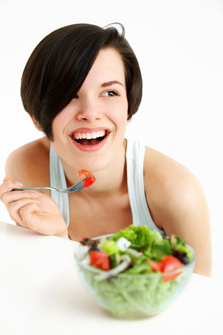 Attractive Brunette Eating a Salad