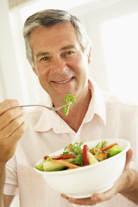 Mature Man Eating Vegetables