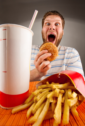 Expressive Man Eating Fast Food