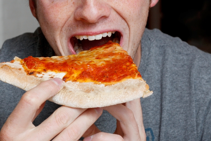 Close-Up of Man Eating Pizza